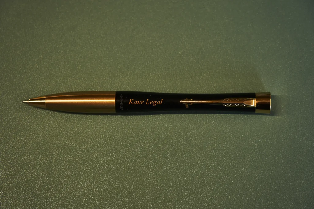 Black_and_gold_pen_with_Kaur_Legal_written_on_it